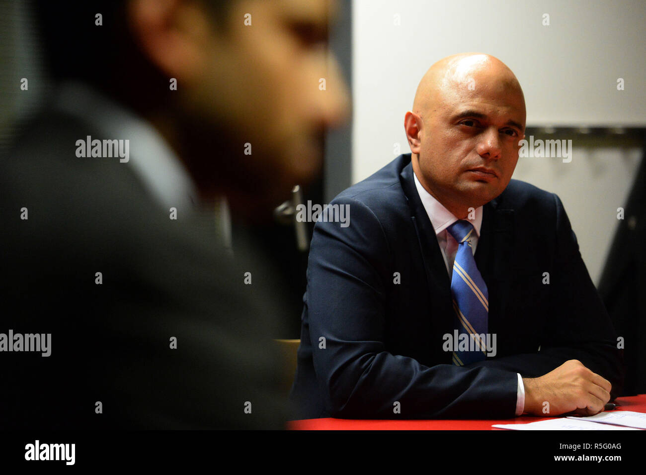 Home Secretary Sajid Javid during a round table discussion on the Prevent anti-terror scheme, at the Chrisp Street Ideas Store in Poplar, London. Stock Photo