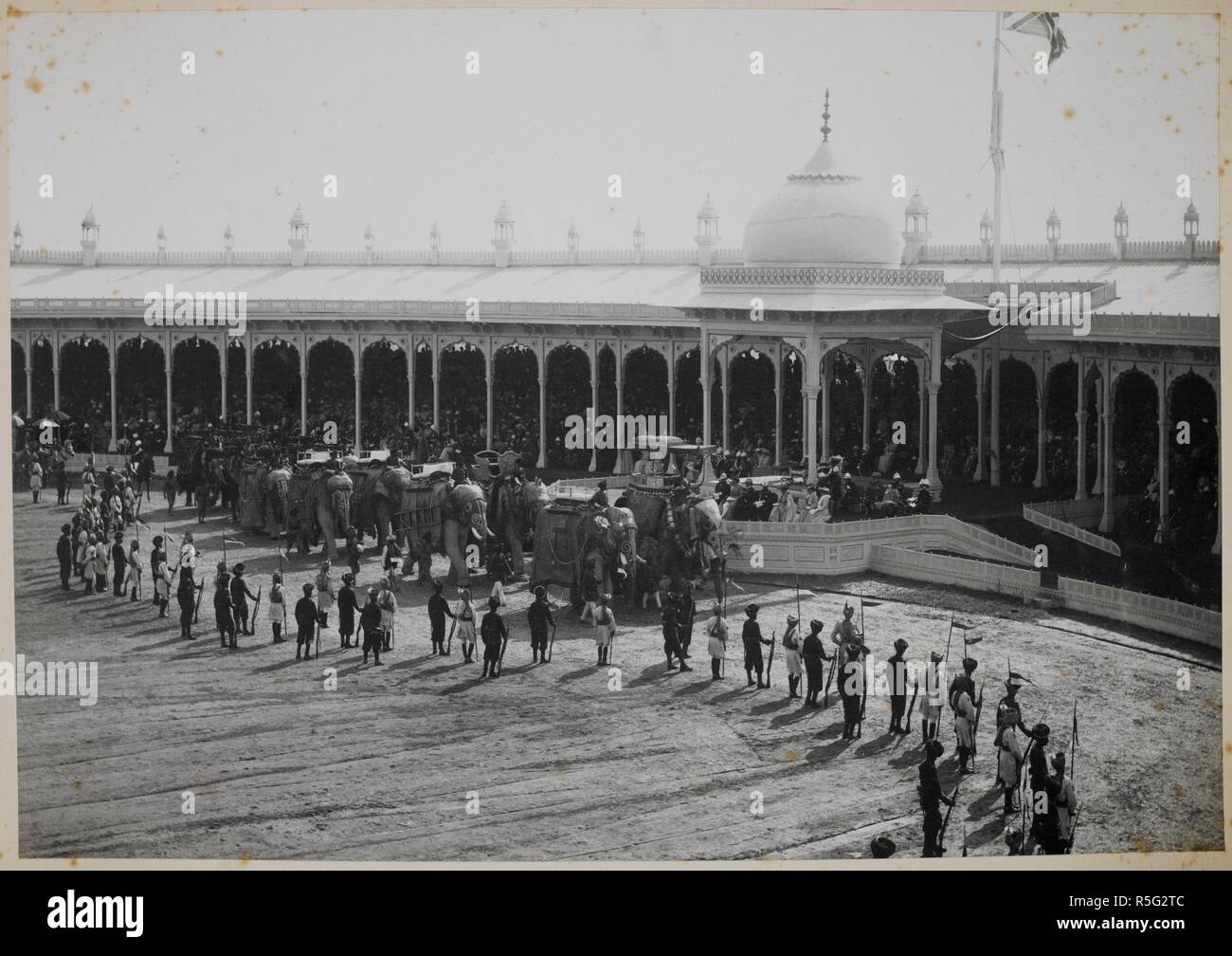 Retainers' Review at the Delhi Durbar: state elephants marching past the Viceregal dais. Curzon Collection: 'Retainer's Review, Delhi, 1903'. 7 Jan. 1903. Photograph. Source: Photo 430/12(1). Author: Bremner, Frederick. Stock Photo