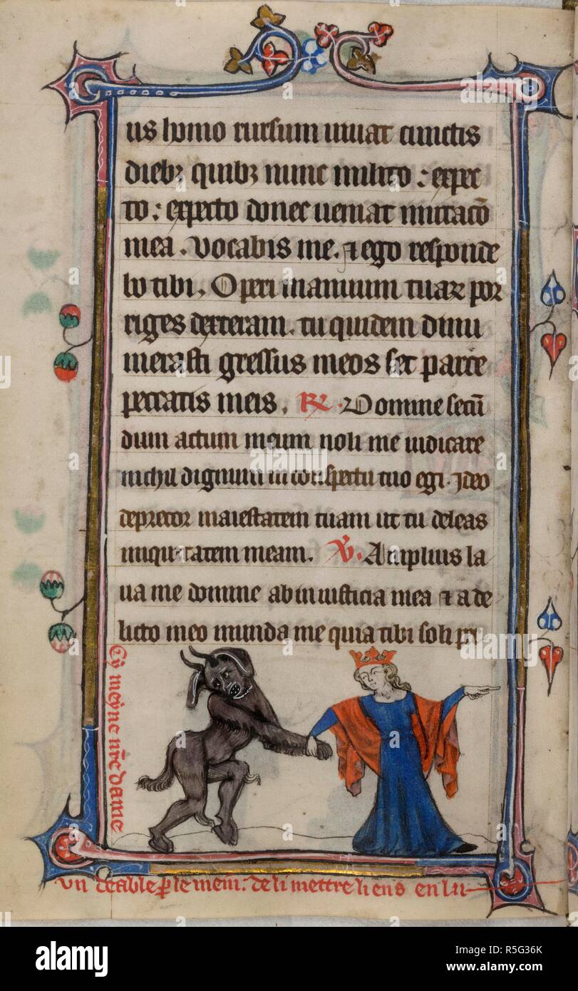 Bas-de-page scene of the Virgin Mary leading a devil by the paw and pointing to the right, with a caption reading, â€˜Cy meyne n[ost]re dame un deable p[ar] le mein de li mettre liens en luâ€¦â€™. Book of Hours, Use of Sarum ('The Taymouth Hours'). England, S. E.? (London?); 2nd quarter of the 14th century. Source: Yates Thompson 13, f.172v. Language: Latin and French. Stock Photo
