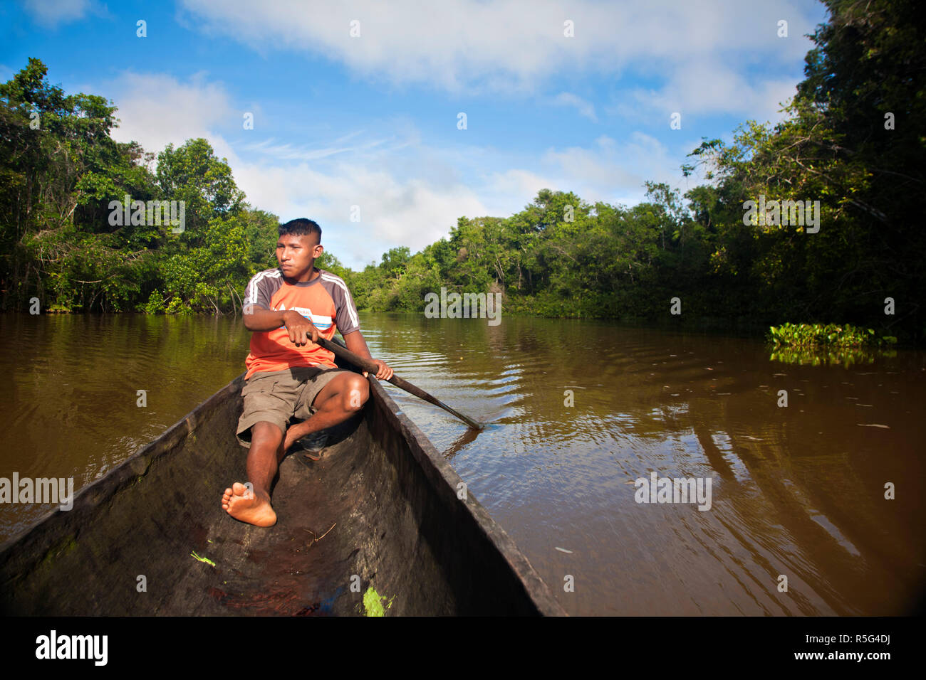 Venezuela, Delta Amacuro, Orinoco Delta, Warao man in dug out canoe Stock Photo
