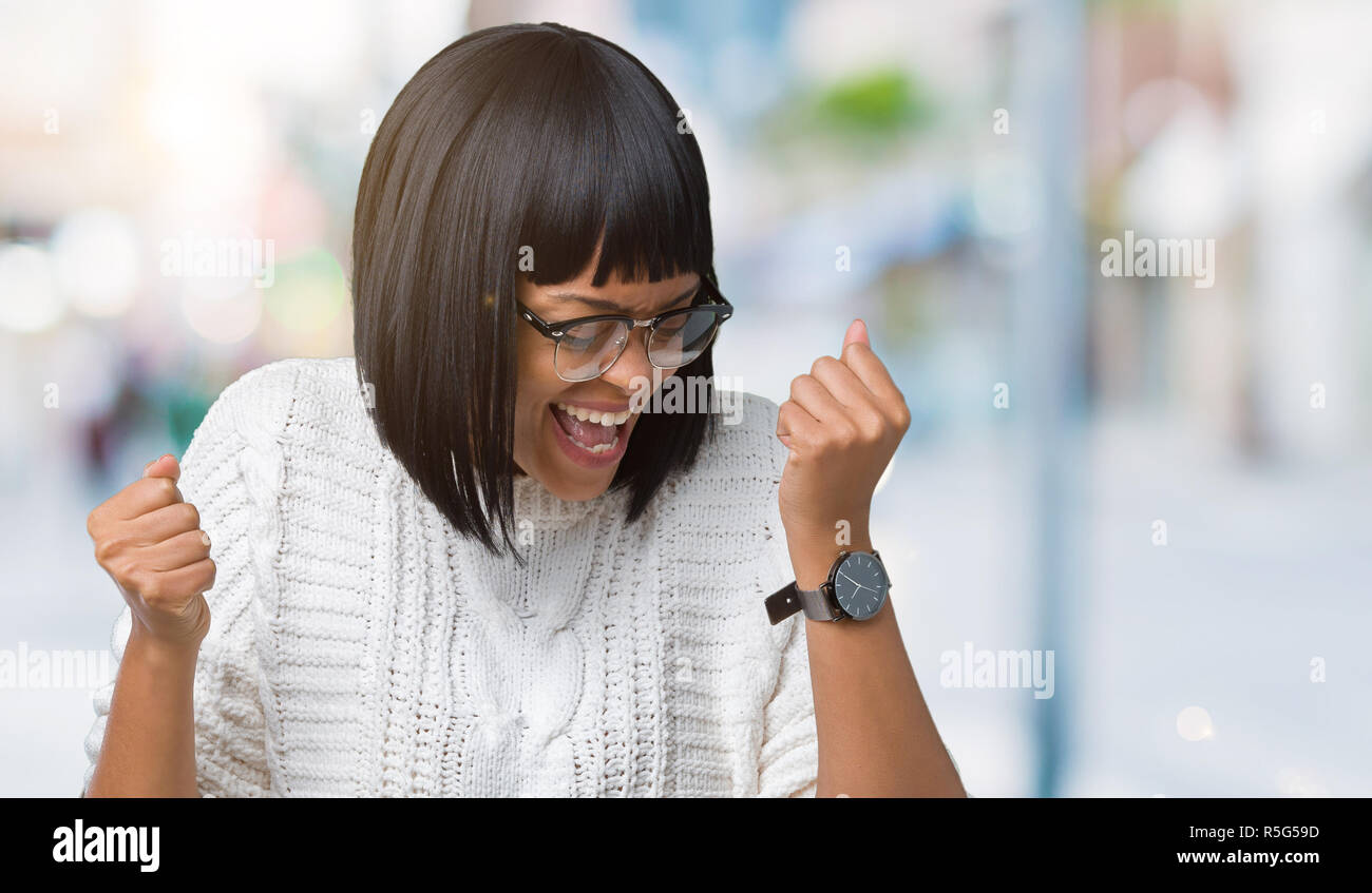 Beautiful young african american woman wearing glasses over isolated ...