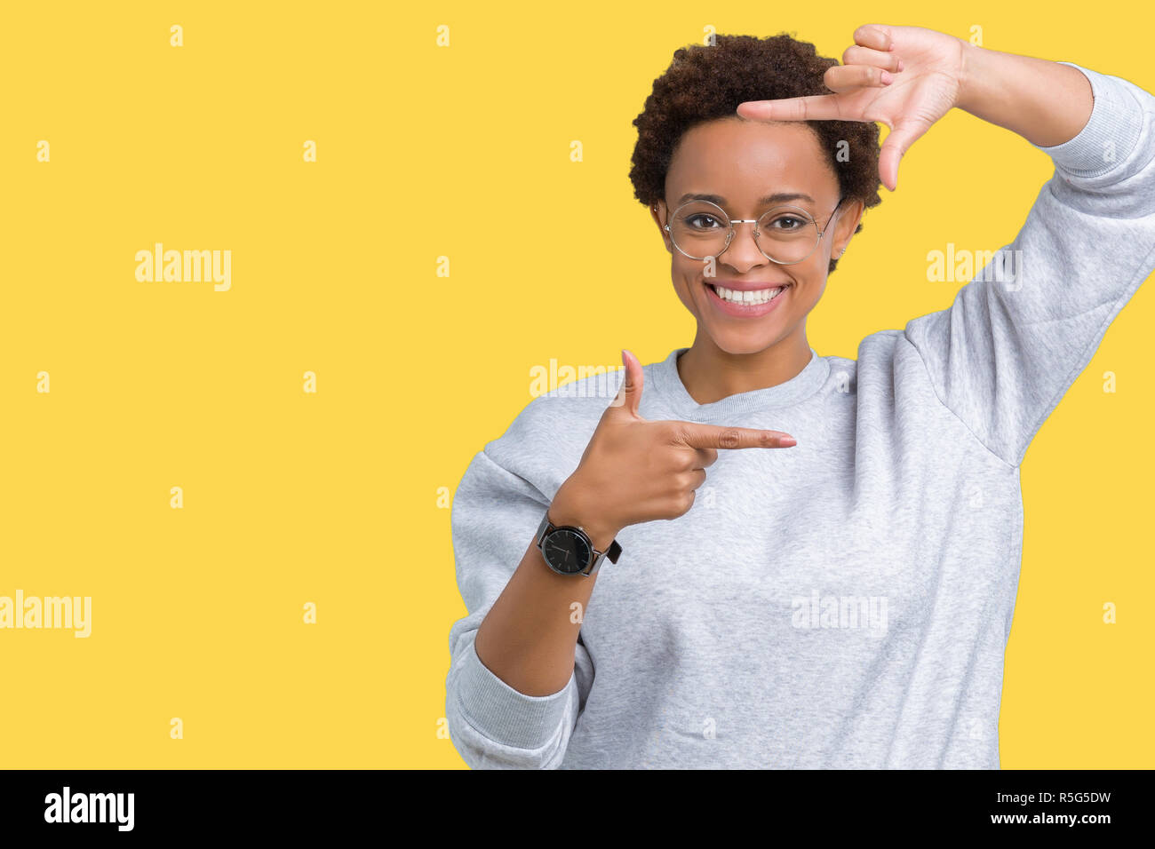 Young beautiful african american woman wearing glasses over isolated ...