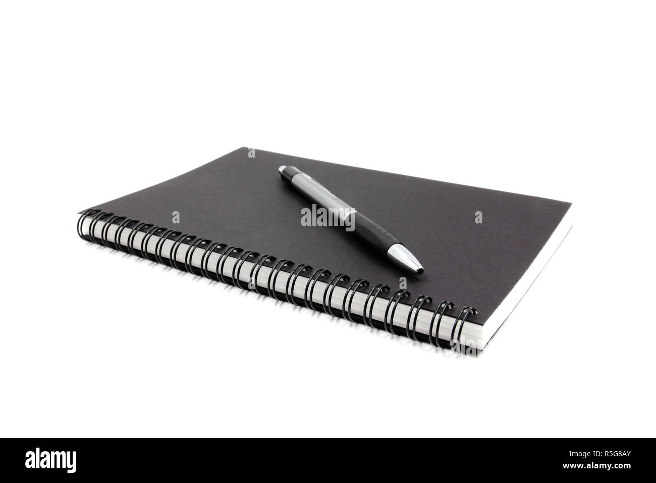 Notebook and pen isolated on white background Stock Photo - Alamy