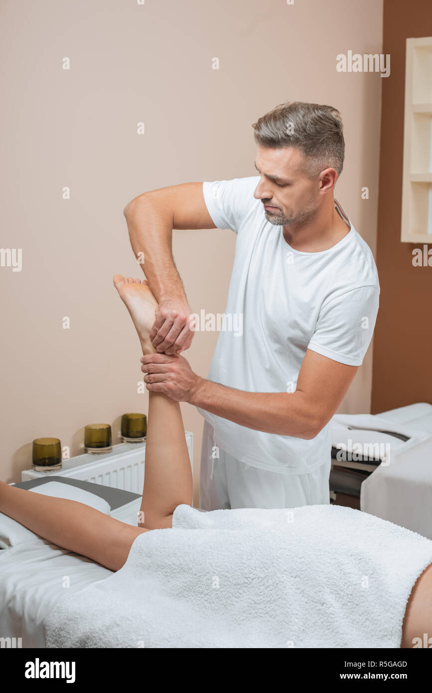 Handsome Masseur Doing Relaxing Feet Massage Stock Photo Alamy