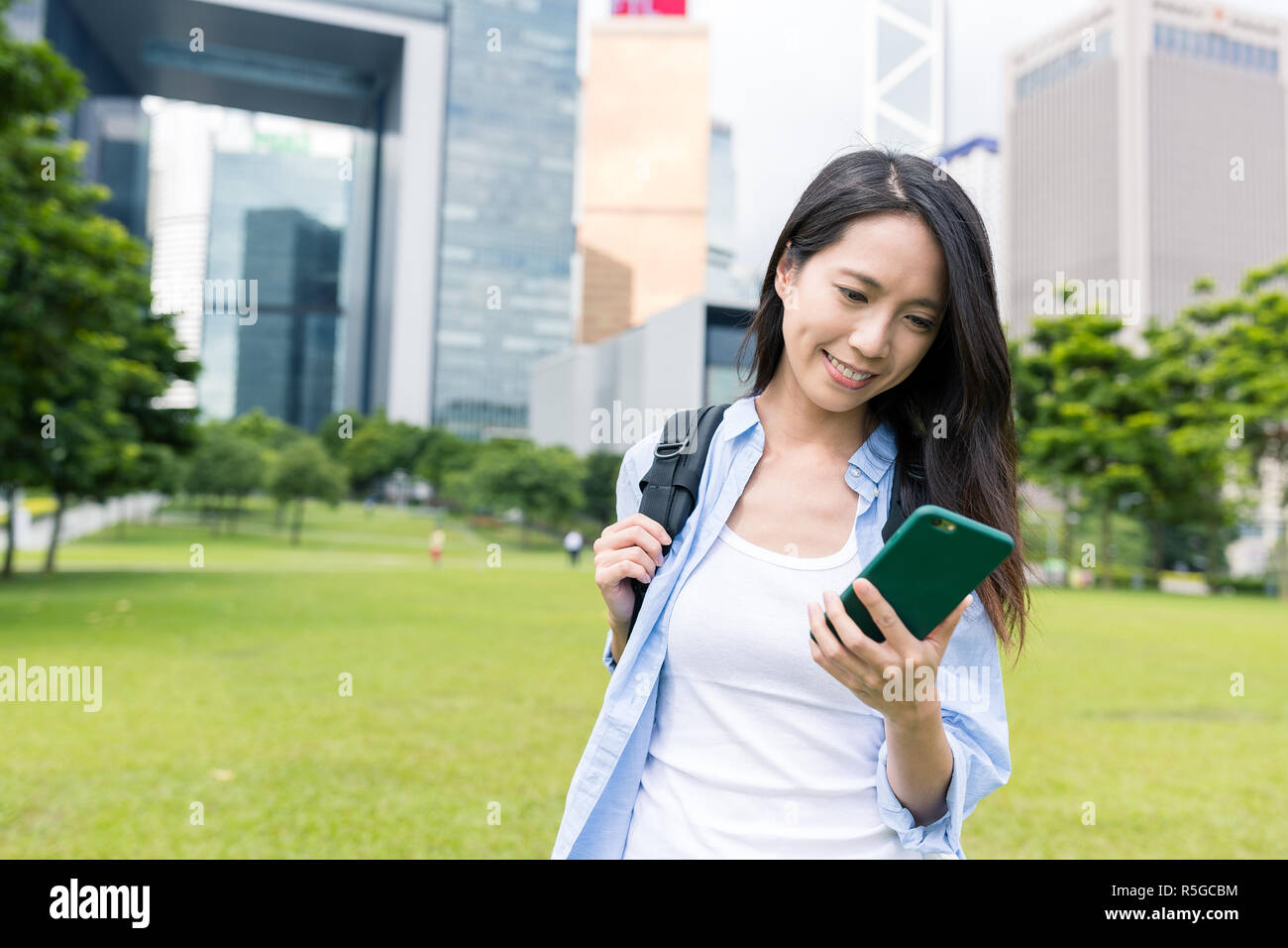 Woman use of mobile phone in Hong Kong Stock Photo - Alamy