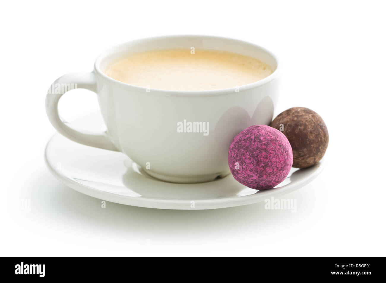 Coffee cup and sweet truffle balls Stock Photo Alamy