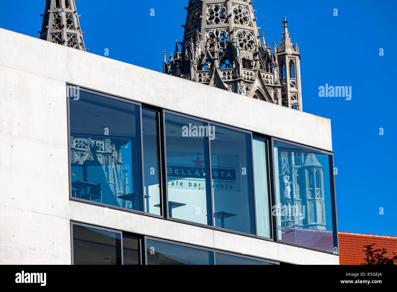 Modern business building, on Muensterplatz, church tower of Ulm
