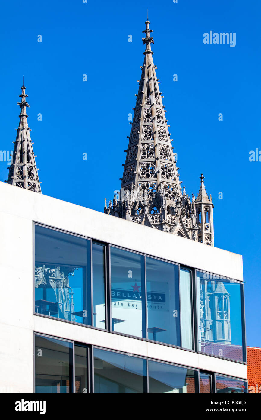 Modern business building, on Muensterplatz, church tower of Ulm