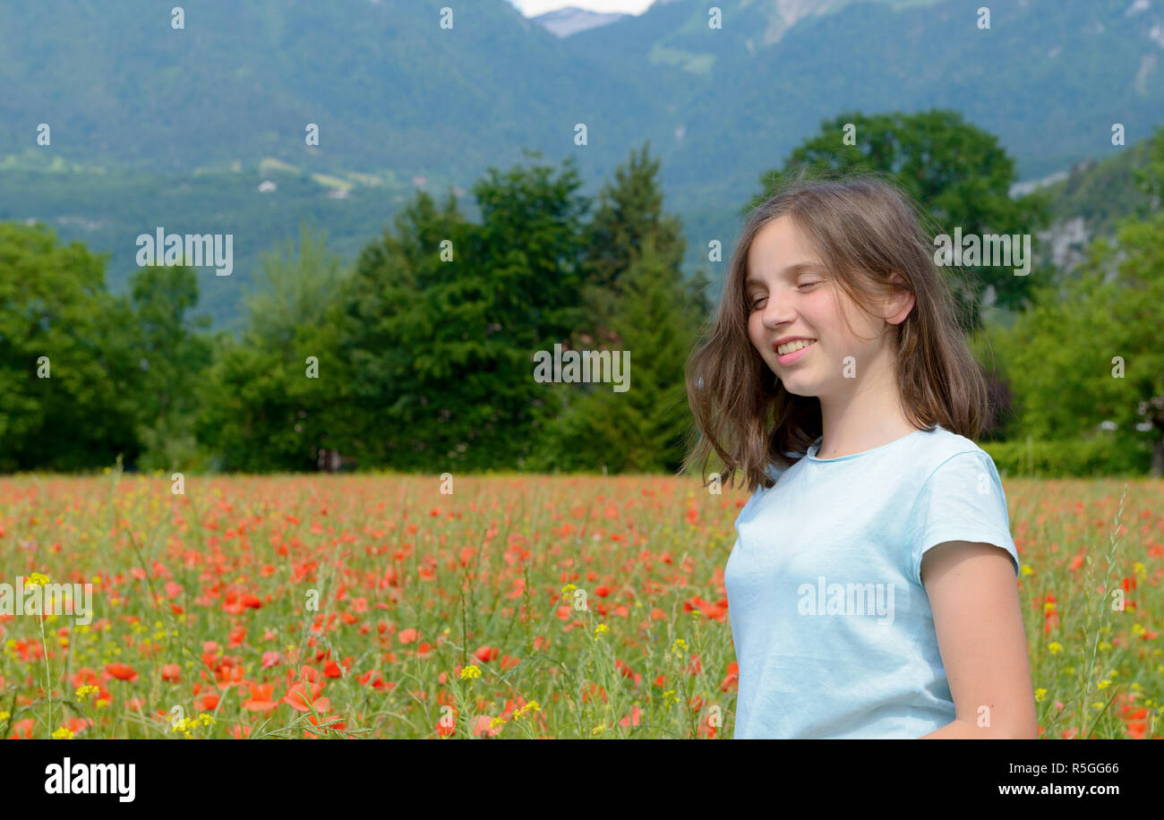 Young teenage girl in poppy field Stock Photo - Alamy