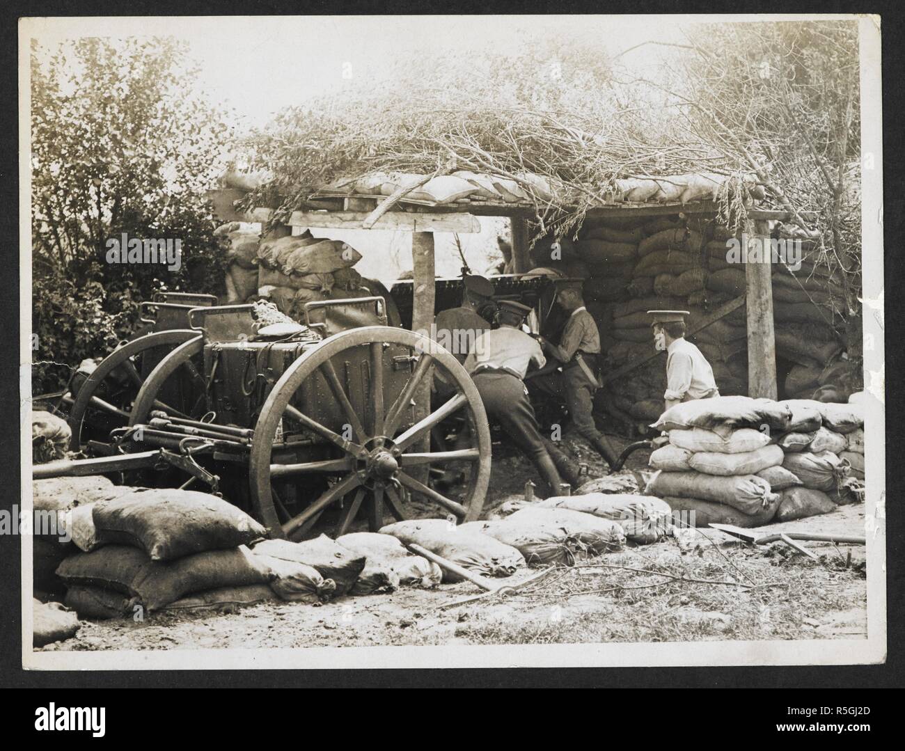 Scene in a battery at the front [Laventie, France]. Officers of the 19th Battery, Royal Field Artillery, relaxing at the entrance to their dugout. 4 August 1915. Record of the Indian Army in Europe during the First World War. 20th century, 1915. Gelatin silver prints. Source: Photo 24/(230). Author: Girdwood, H. D. Stock Photo