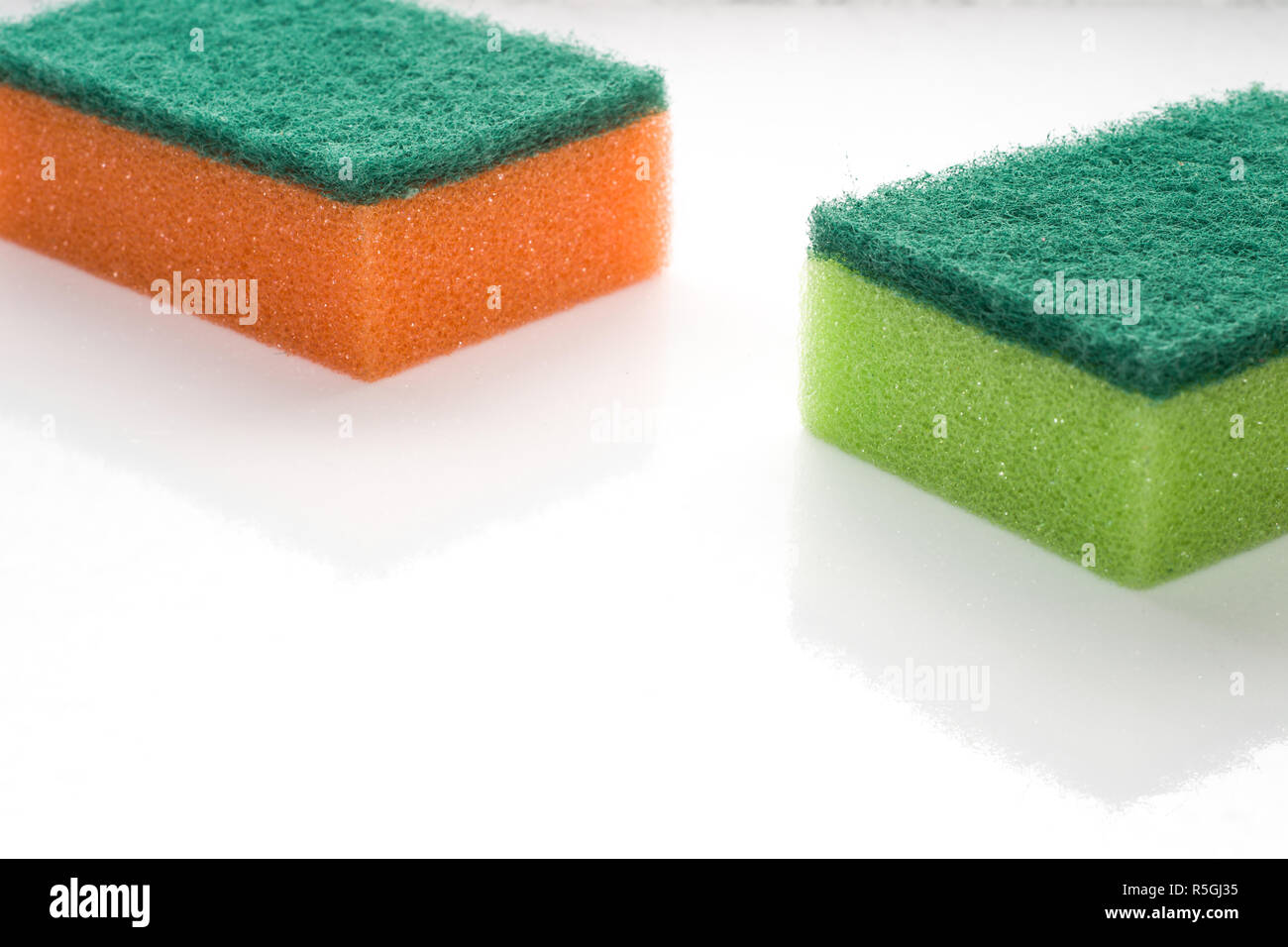 Kitchen sponges isolated on white background Stock Photo - Alamy