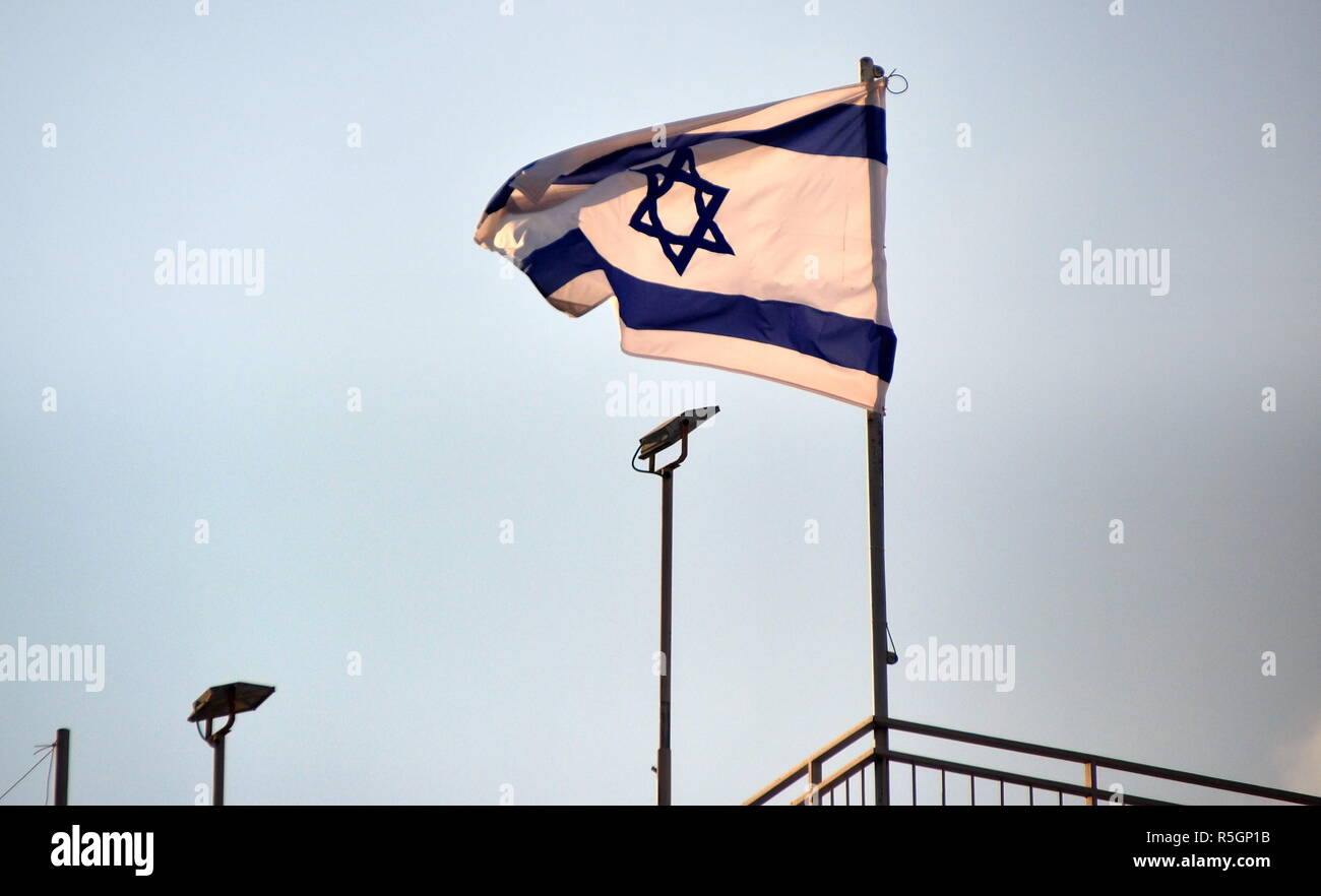 israeli flag blowing in the wind in jerusalem Stock Photo
