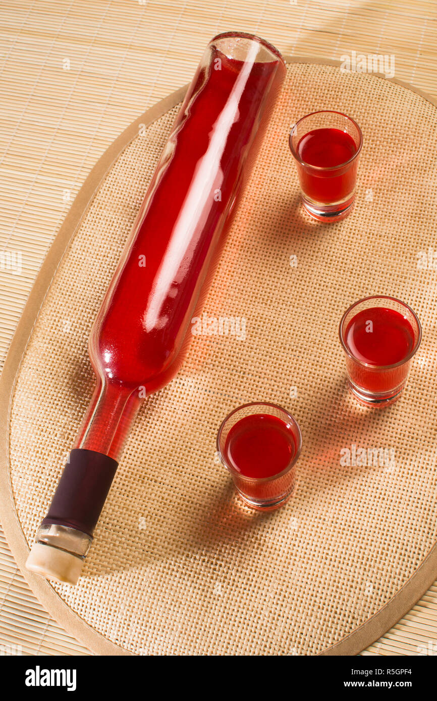 bottle of alcohol with glasses Stock Photo Alamy
