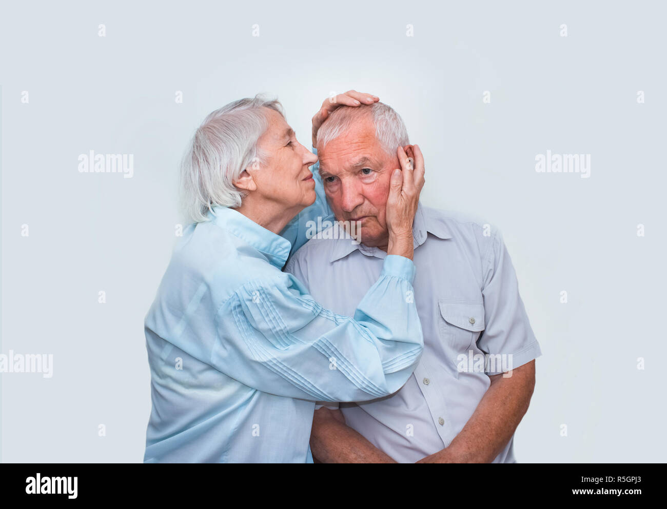 The elderly couple on studio background Stock Photo