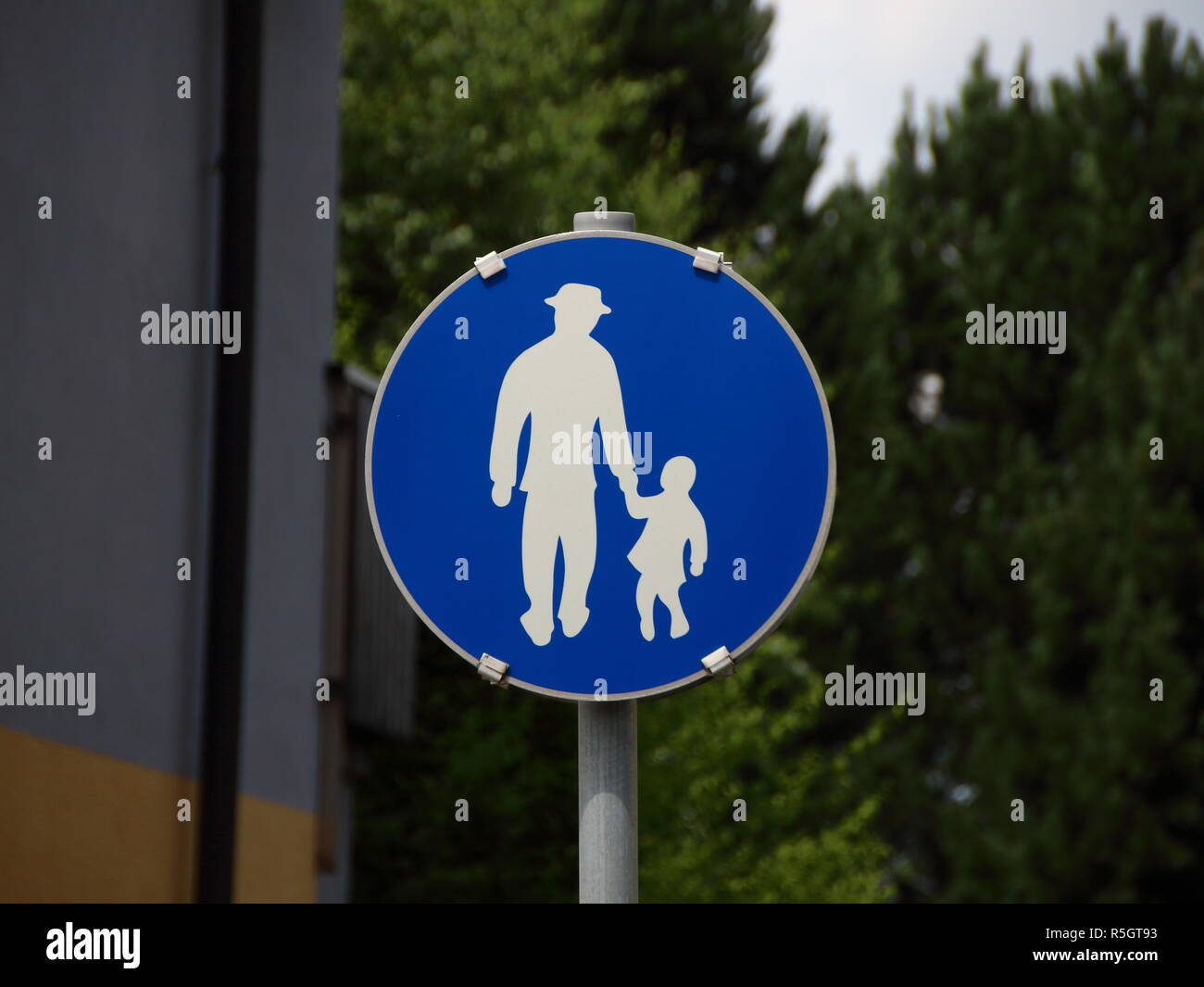 Blue Pedestrian Sign with Man and Child Stock Photo