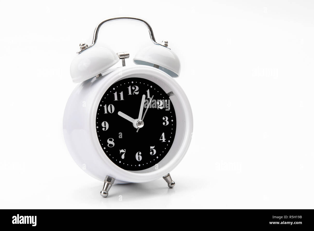 Retro alarm clock isolate on white backgound Stock Photo - Alamy
