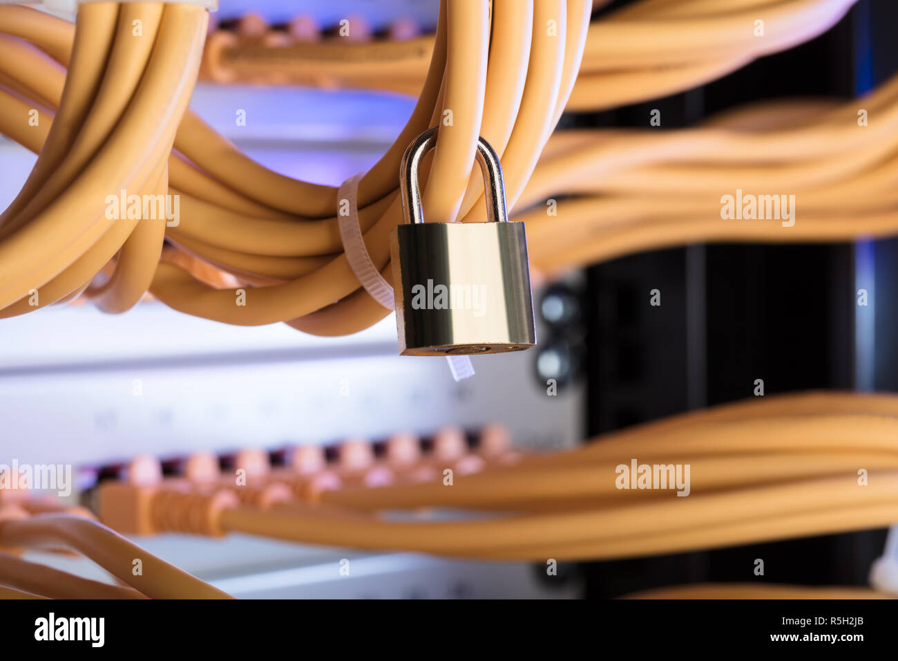 Padlock Attached To Network Cable In Server Room Stock Photo