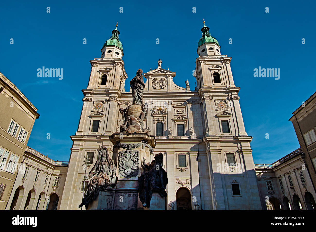 Salzburg Cathedral or Salzburger Dom with the fountain is the 17-th century baroque roman catholic church in Salzburg, Austria. Salzburg Cathedral is  Stock Photo