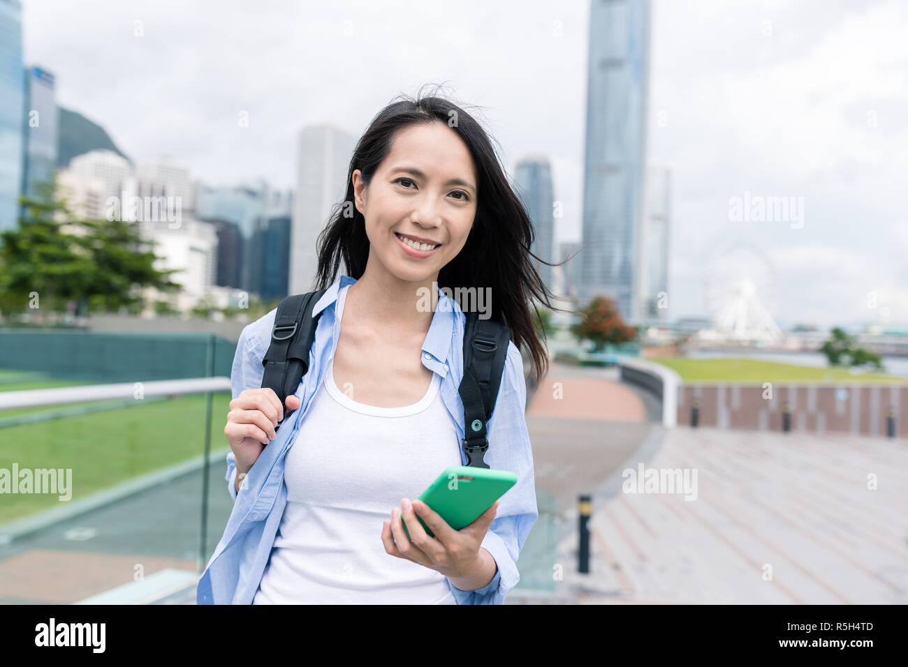 Woman use of smart phone in Hong Kong city Stock Photo - Alamy