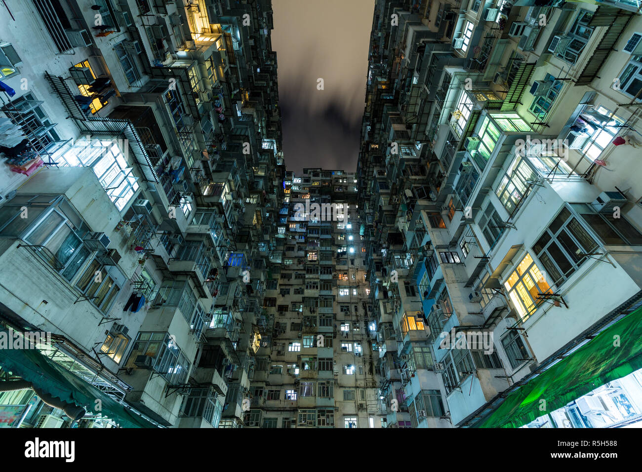 Residential building in Hong Kong at night Stock Photo - Alamy