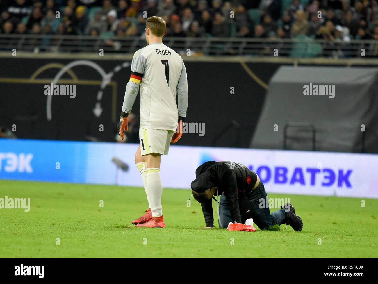 Leipzig, Germany - November 15, 2018. Germany national team goalkeeper Manuel Neuer with Russian fan who run onto the pitch during international frien Stock Photo