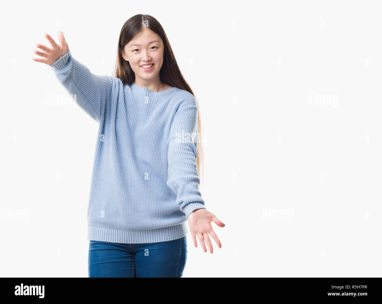 Young Chinese woman over isolated background looking at the camera