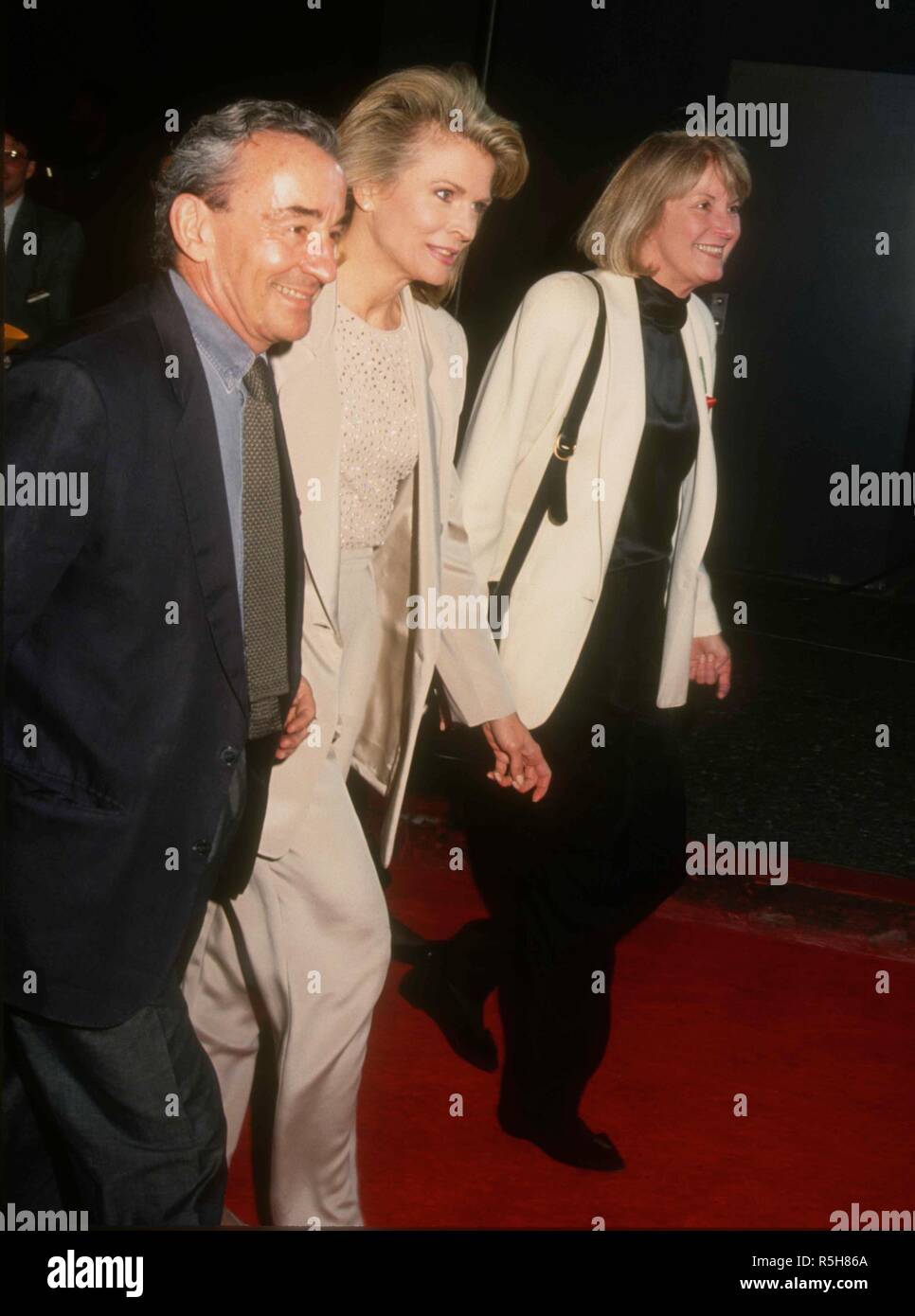 UNIVERSAL CITY, CA - MARCH 9: Director Louis Malle, wife actress Candice Bergen and publicist Pat Kingsley attend the 19th Annual People's Choice Awards on March 9, 1993 at Unversal Studios in Universal City, California. Photo by Barry King/Alamy Stock Photo Stock Photo