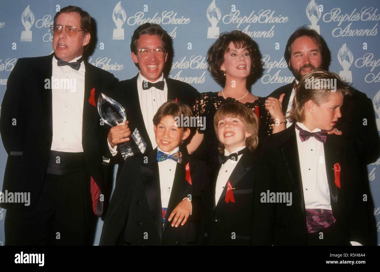 BEVERLY HILLS, CA - MARCH 17: (L-R) Actors Earl Hindman, Tim Allen, Patricia Richardson, Pamela Anderson, Richard Kam (back row) and Taran Noah Smith, Jonathan Taylor Thomas and Zachery Ty Bryan (front)attends the 18th Annual People's Choice Awards on March 17, 1992 at Universal Studios in Universal City, California. Photo by Barry King/Alamy Stock Photo Stock Photo