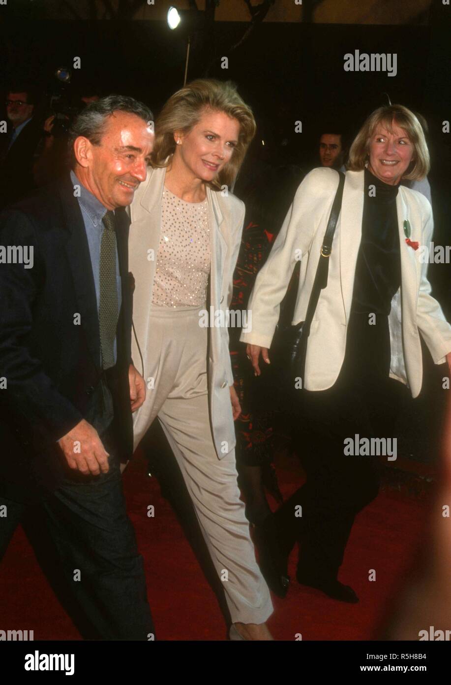 UNIVERSAL CITY, CA - MARCH 9: Director Louis Malle, wife actress Candice Bergen and publicist Pat Kingsley attend the 19th Annual People's Choice Awards on March 9, 1993 at Unversal Studios in Universal City, California. Photo by Barry King/Alamy Stock Photo Stock Photo
