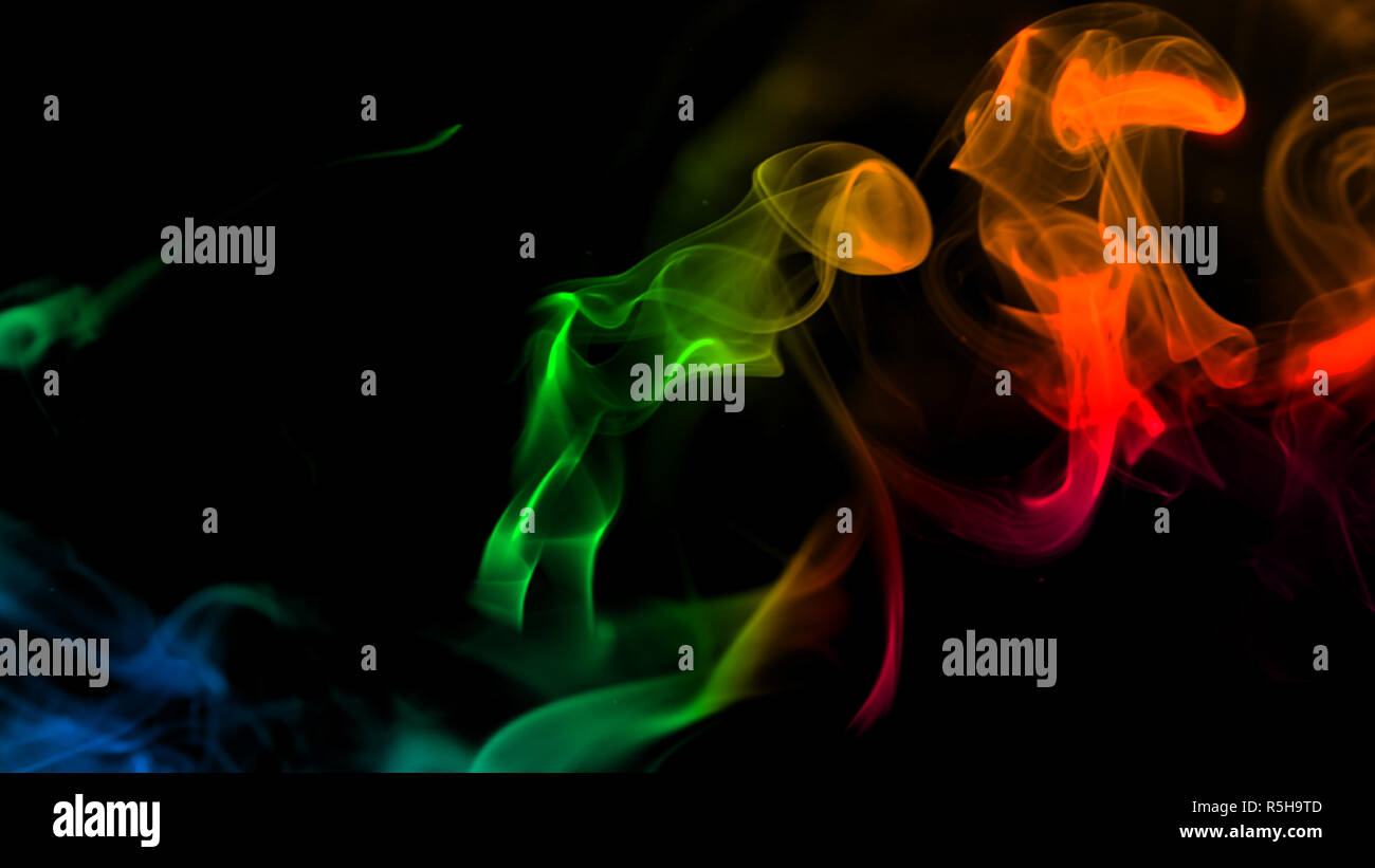 Colorful smoke on black background Stock Photo - Alamy