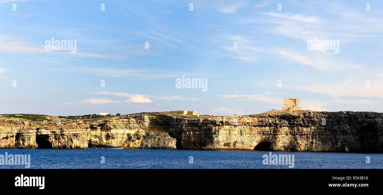 The cliffs of Comino and St Marys watch Tower Stock Photo