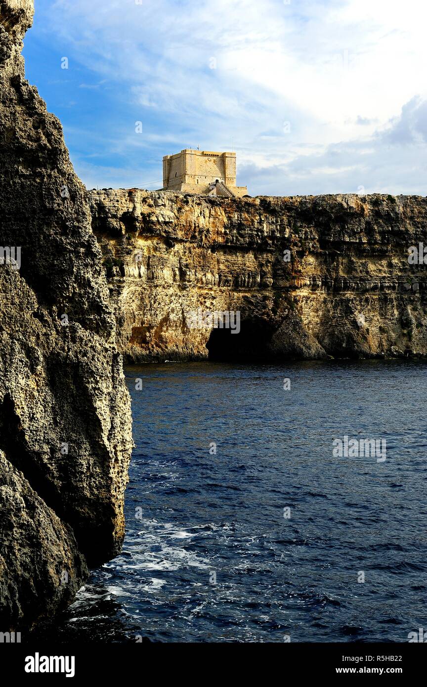 The cliffs of Comino and St Marys watch Tower Stock Photo