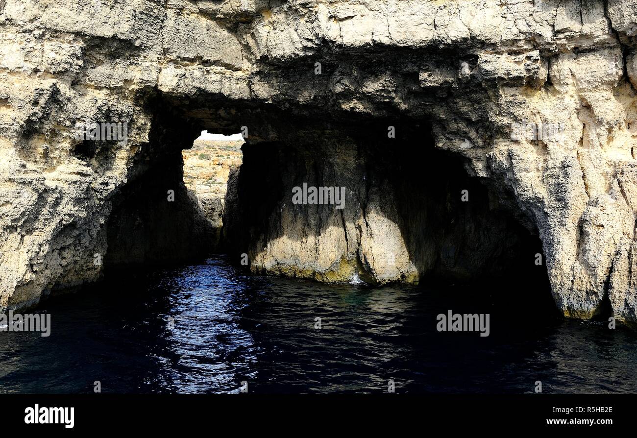 The cliffs and caves of Comino Stock Photo