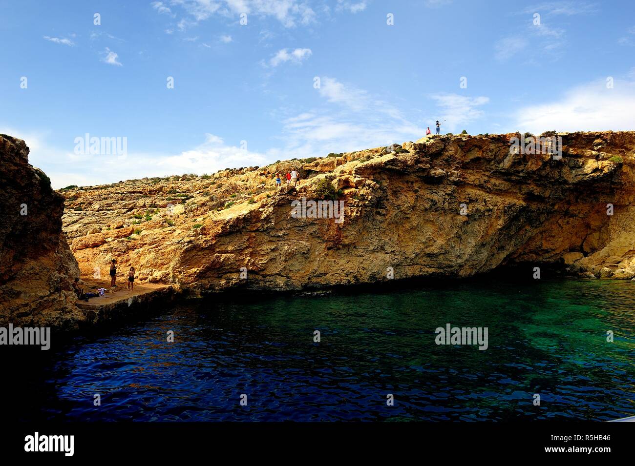 Comino, Malta - 12th October 2018:Holiday makers on the jetty Stock Photo