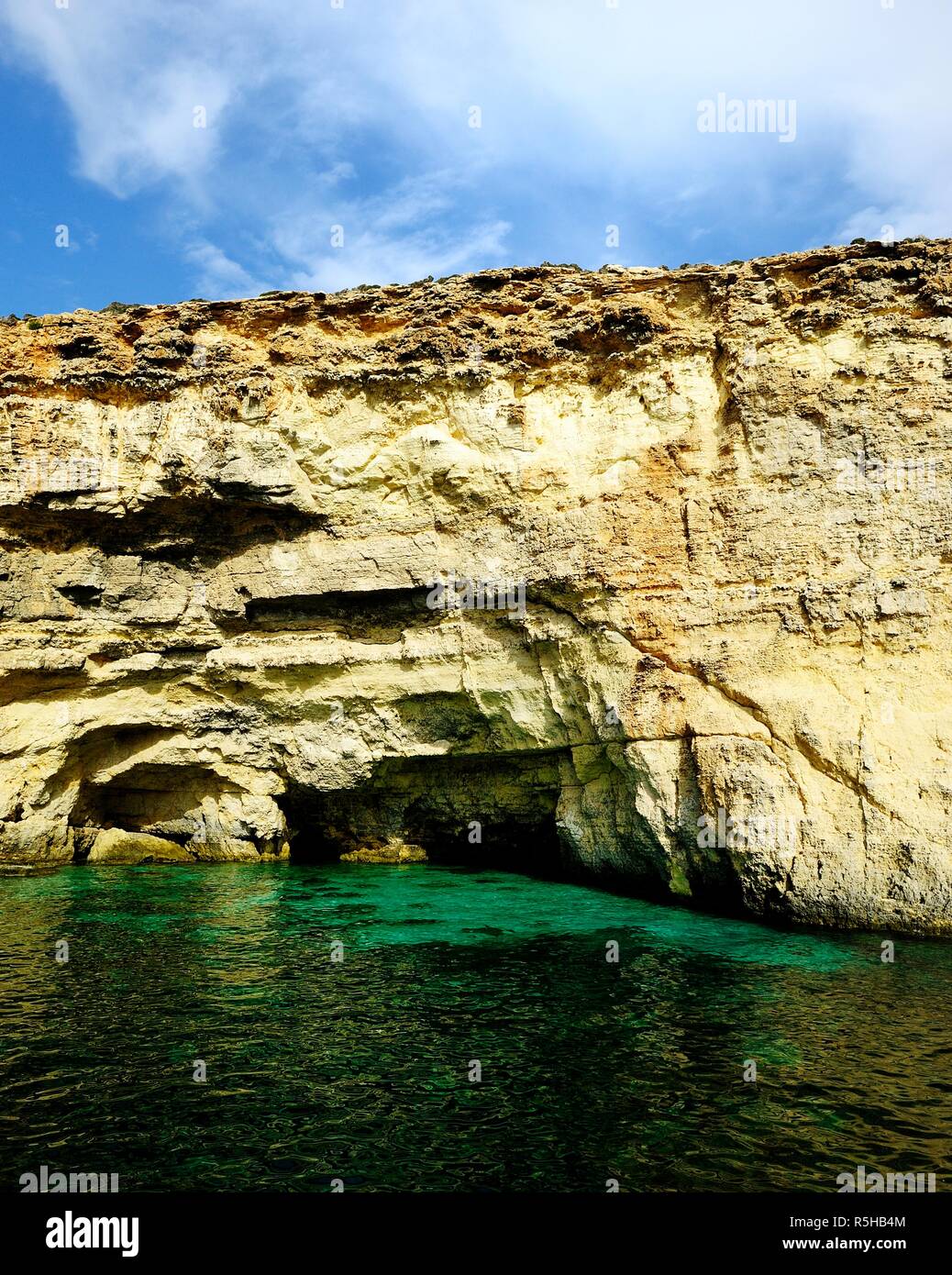 The cliffs of Comino and St Marys watch Tower Stock Photo