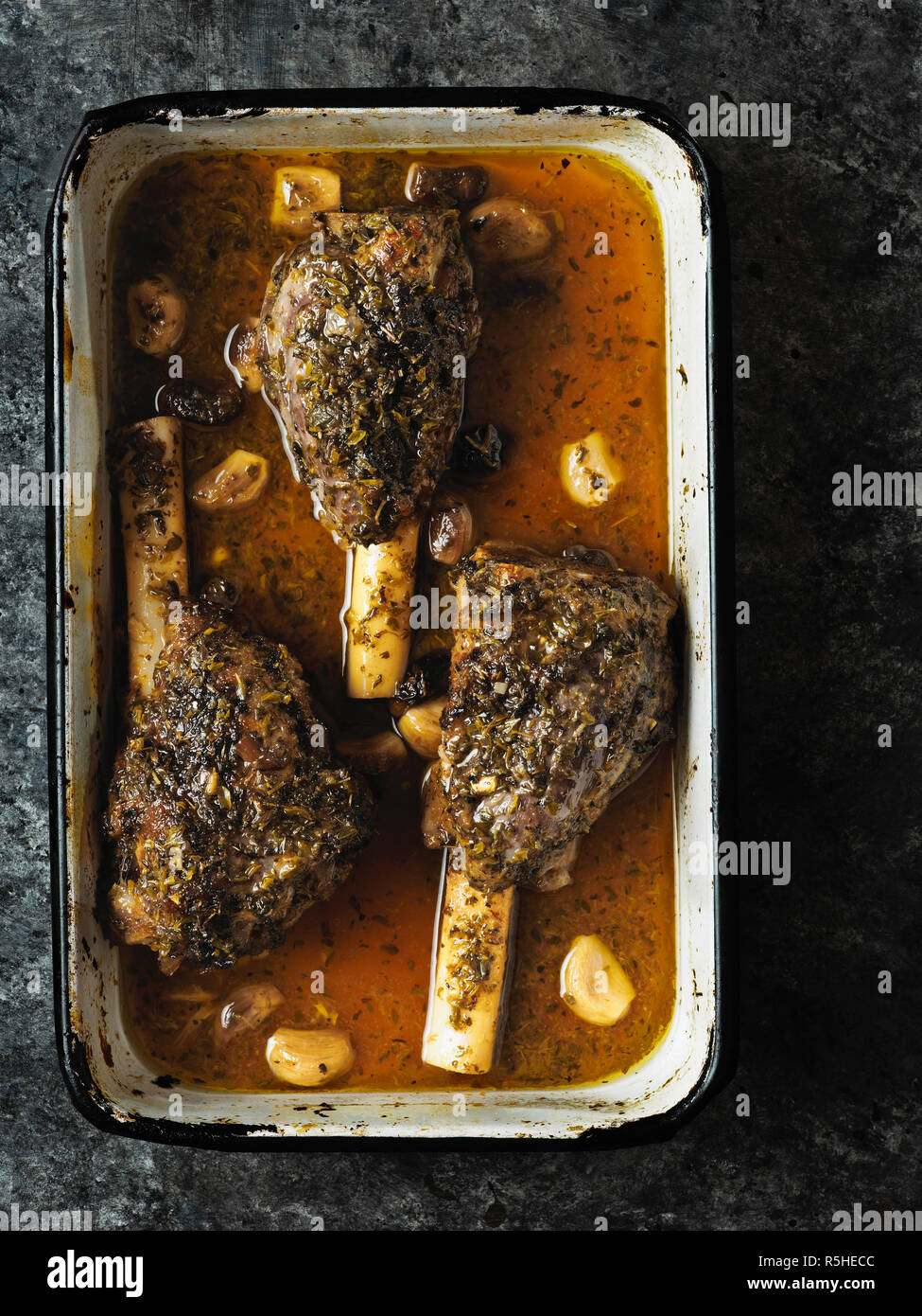 rustic greek roasted lamb shank Stock Photo - Alamy