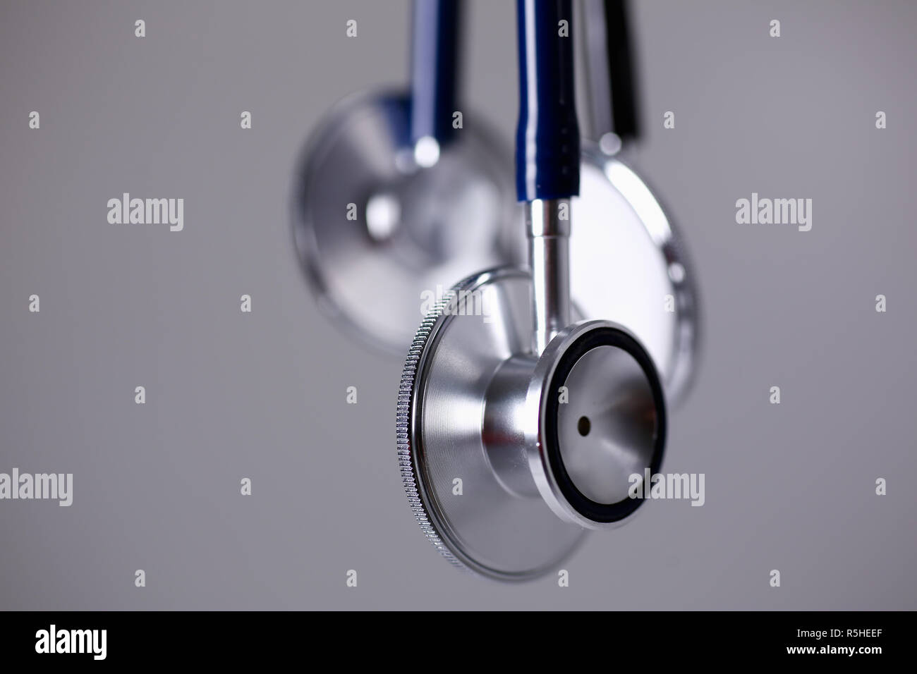 Heads of a stethoscope on a gray Stock Photo Alamy