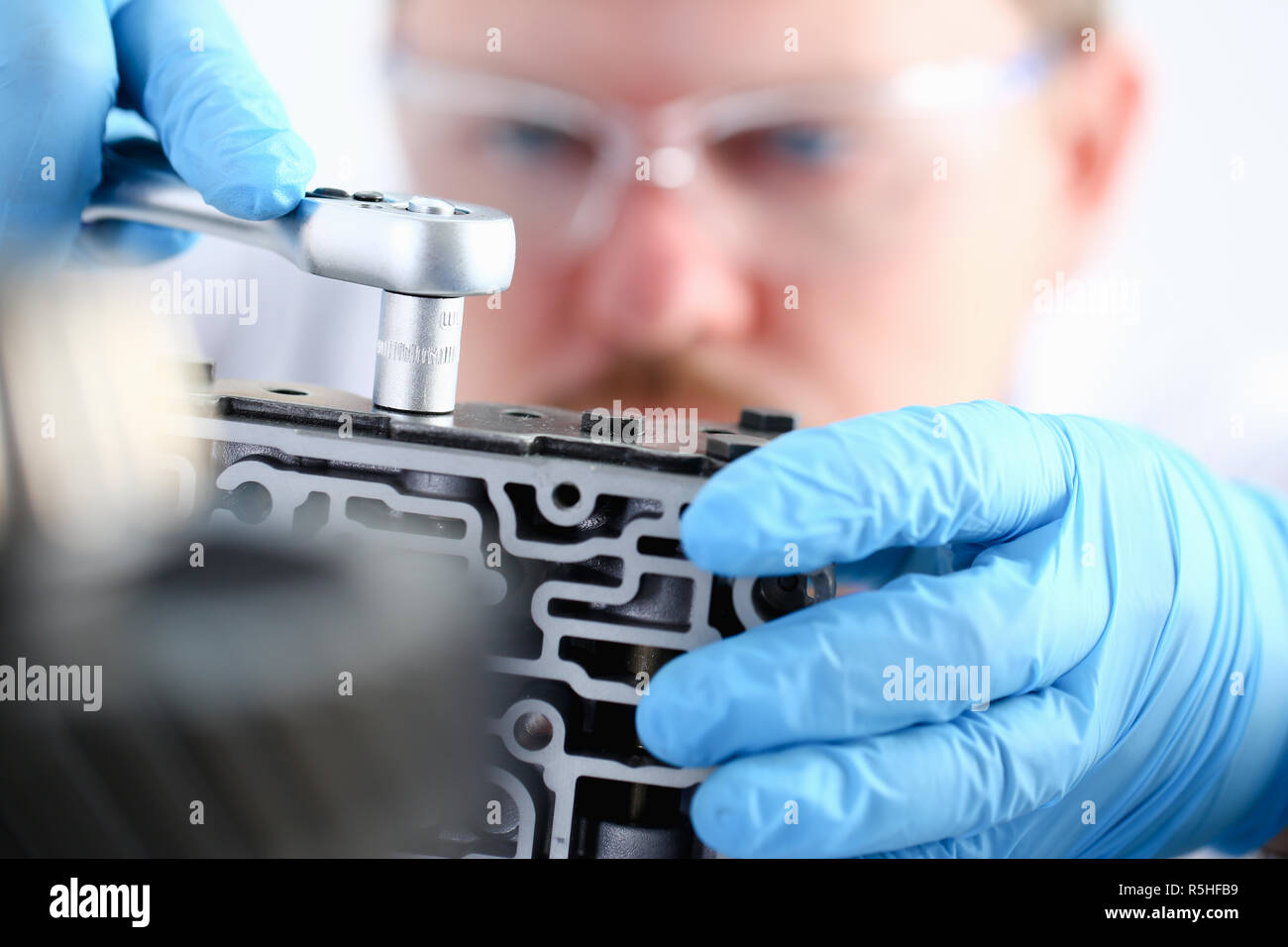 Repairman carcare center on repair of Stock Photo Alamy