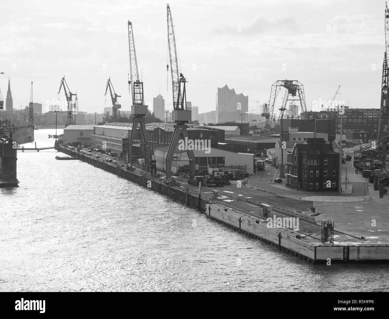 Port of Hamburg with Elbphilharmonie in black and white Stock Photo