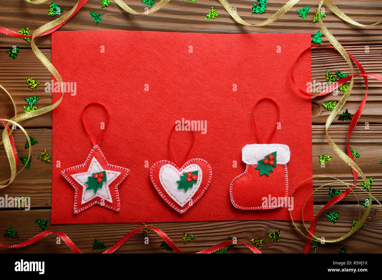 Handmade Rustic Christmas Tree Decorations With Red Felt On Wooden 