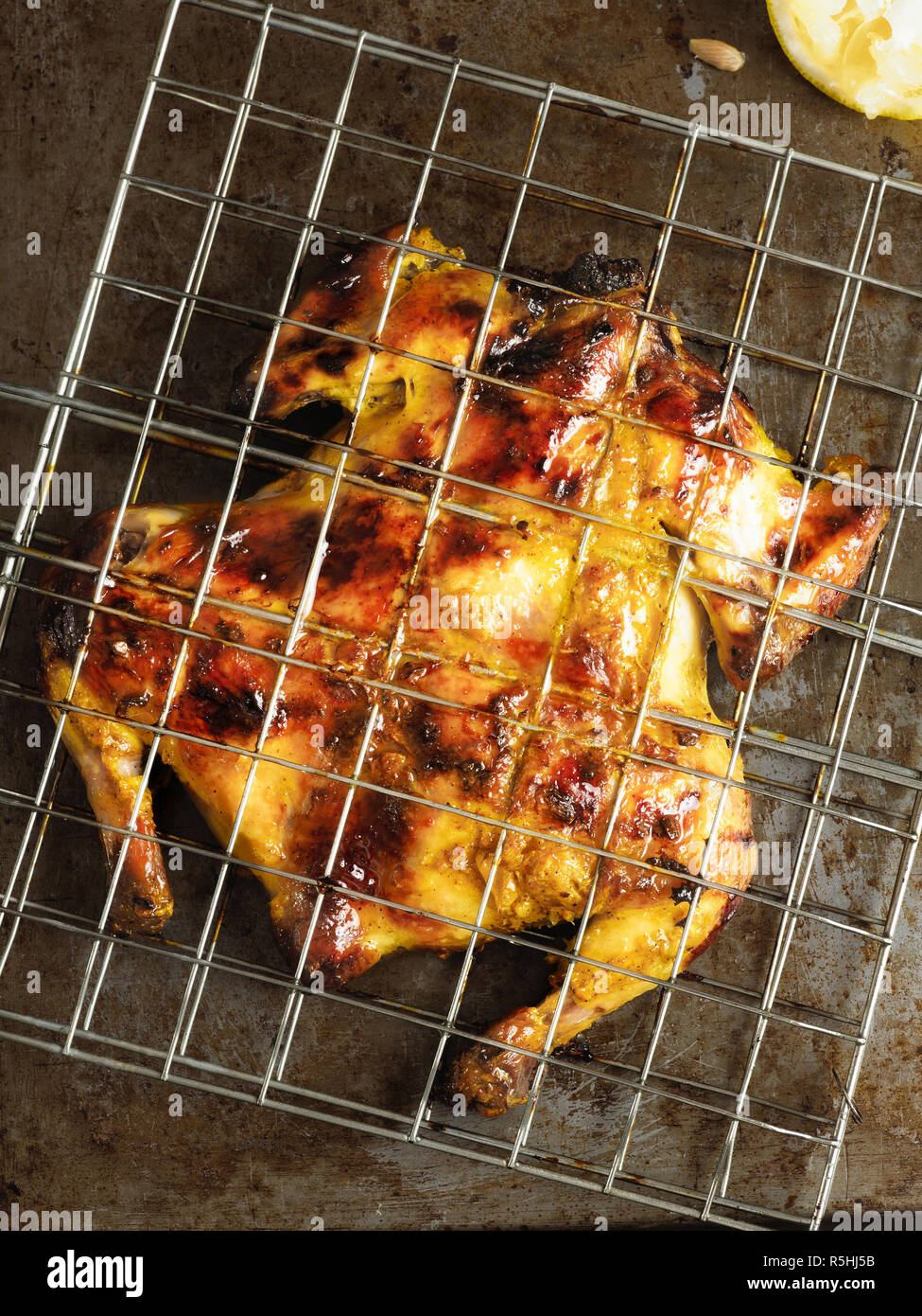 rustic barbecued whole chicken Stock Photo