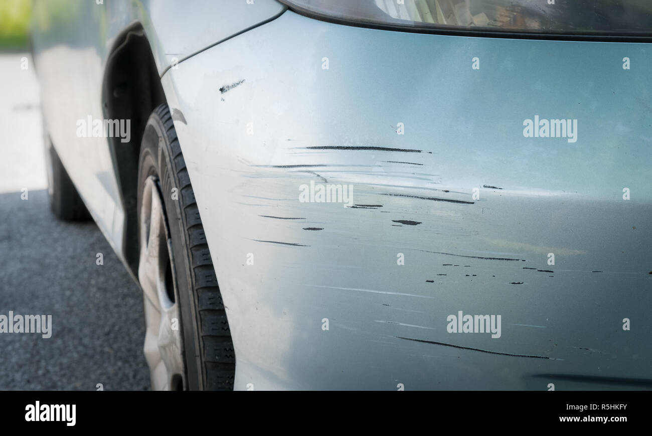 Scratched car with deep damage to the paint Stock Photo
