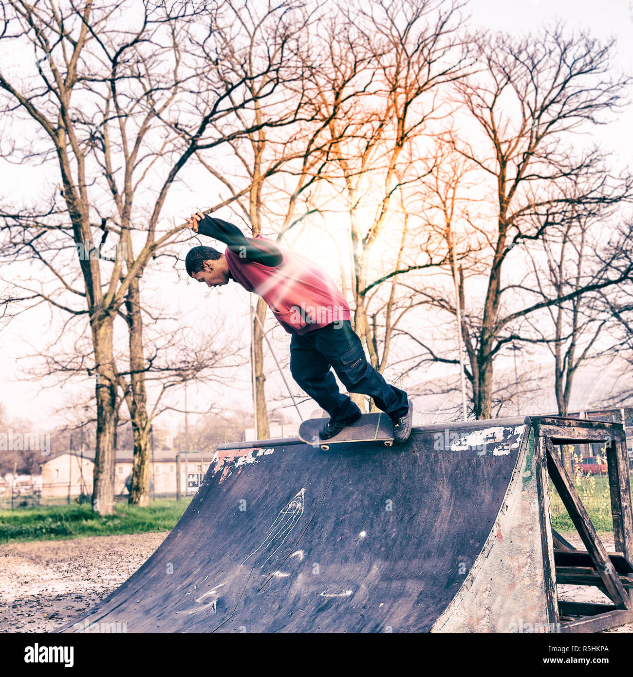 young skateboarder jumping on a ramp outdoor Stock Photo - Alamy