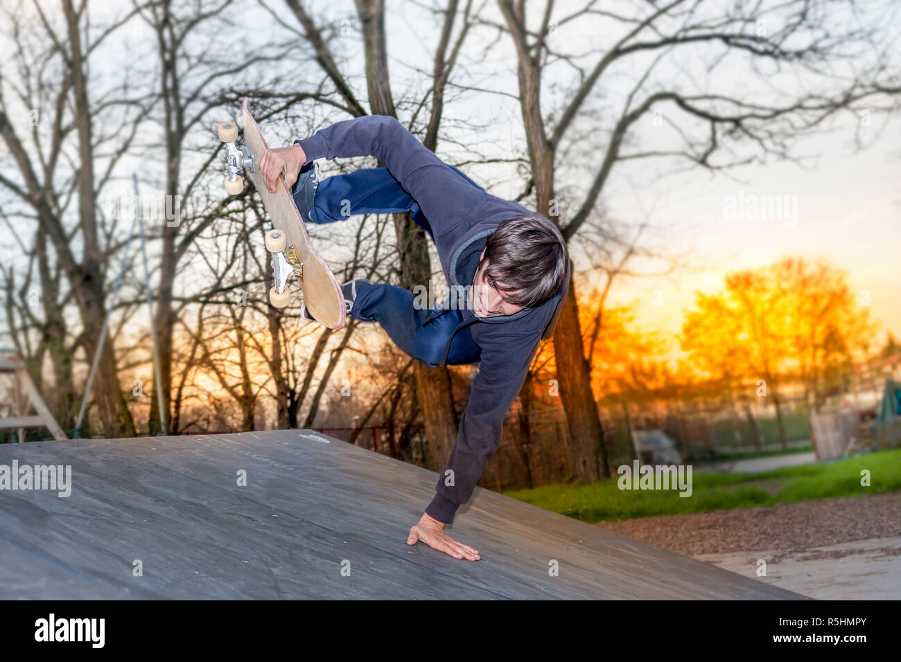young skateboarder jumping on a ramp outdoor Stock Photo - Alamy