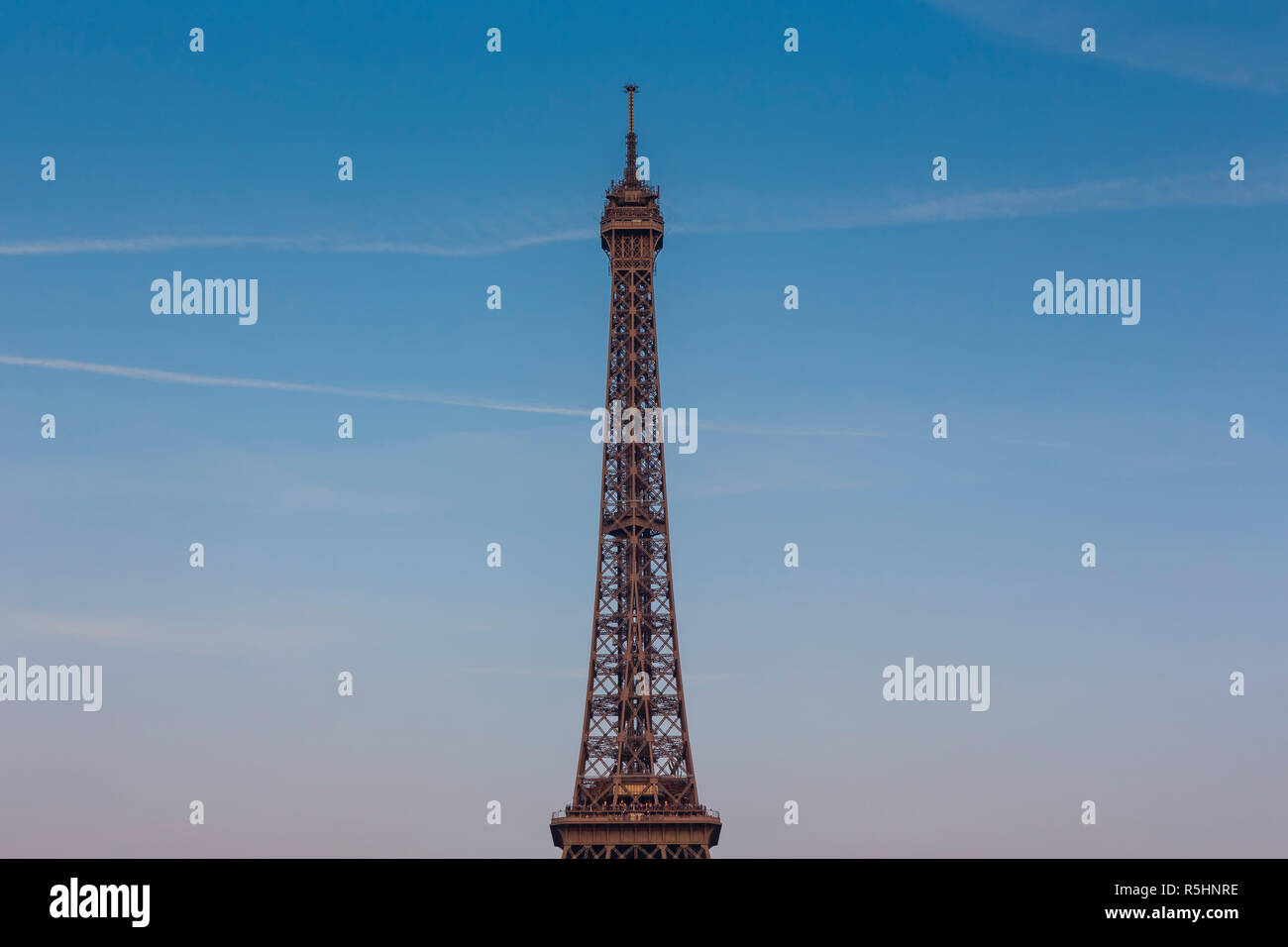 Eiffel Tower, a wrought-iron lattice tower on the Champ de Mars in Paris, France, photographed from the second level and above at the golden hour. Stock Photo
