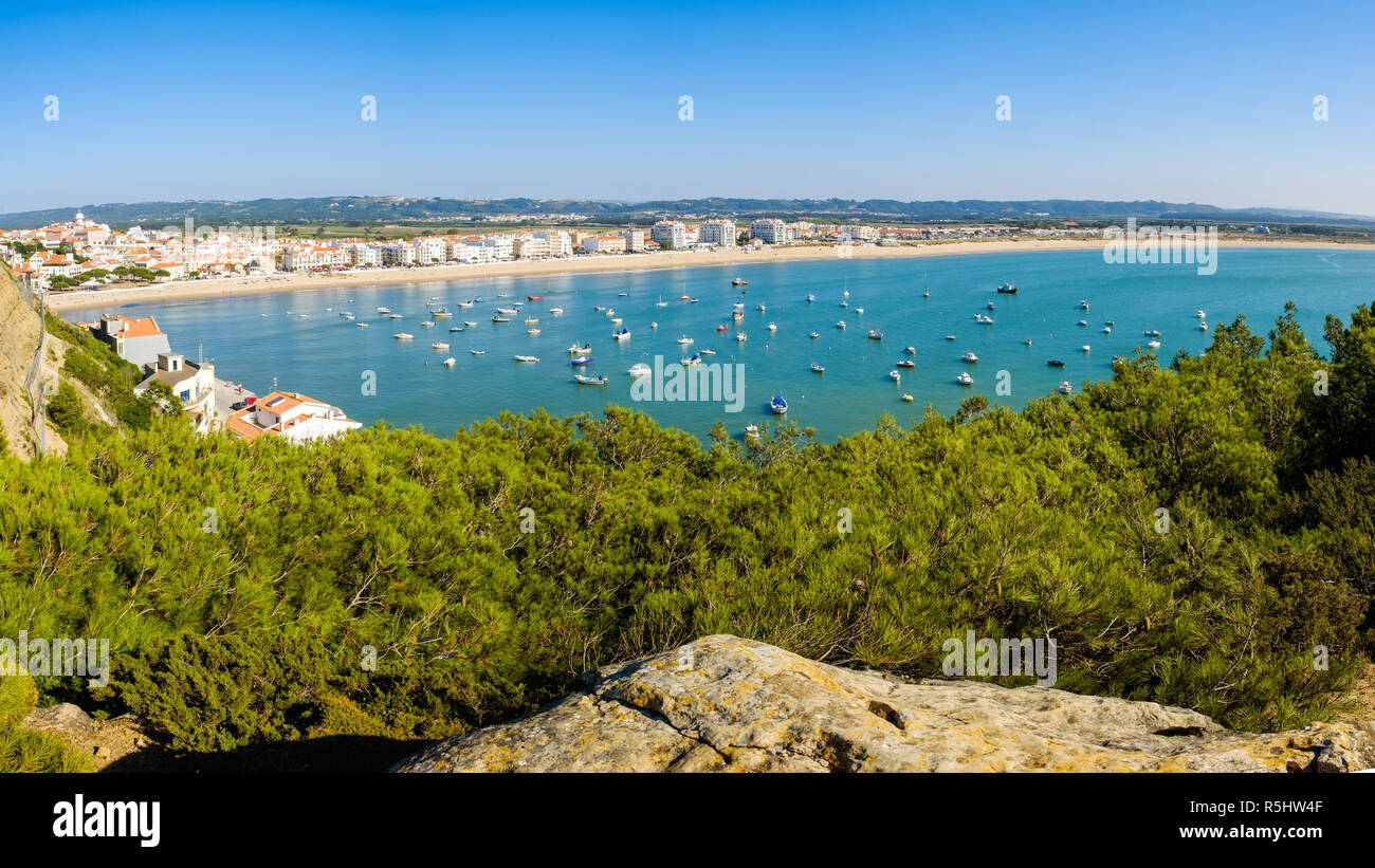 S. Martinho do Porto, Portugal - September 20, 2018 : Nearly closed sea bay, fine sand beach and clear water Alcobaca, Portugal Stock Photo