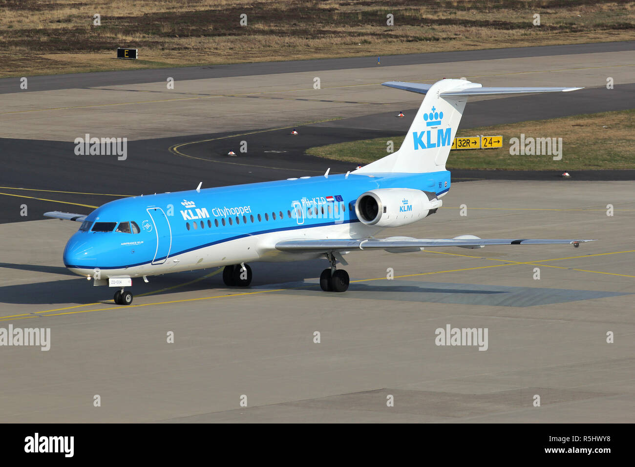 Dutch KLM cityhopper Fokker 70 with registration PH-KZD  taxiing to terminal. Stock Photo