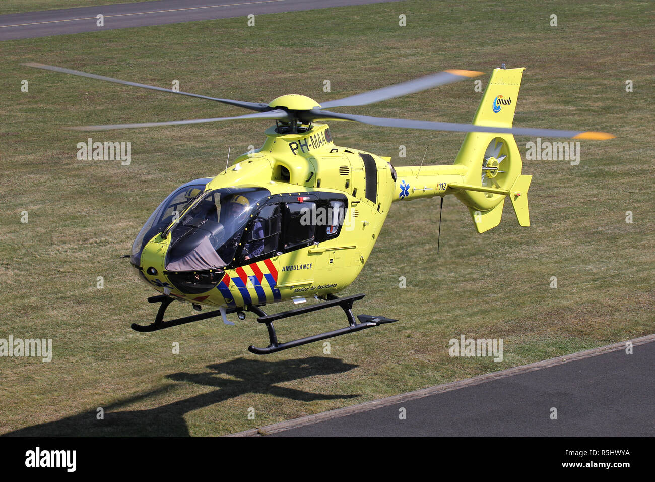 ANWB Medical Air Assistance Eurocopter EC-135T2+ with registration PH-MAA departing after maintenance at Bonn Hangelar Airport. Stock Photo