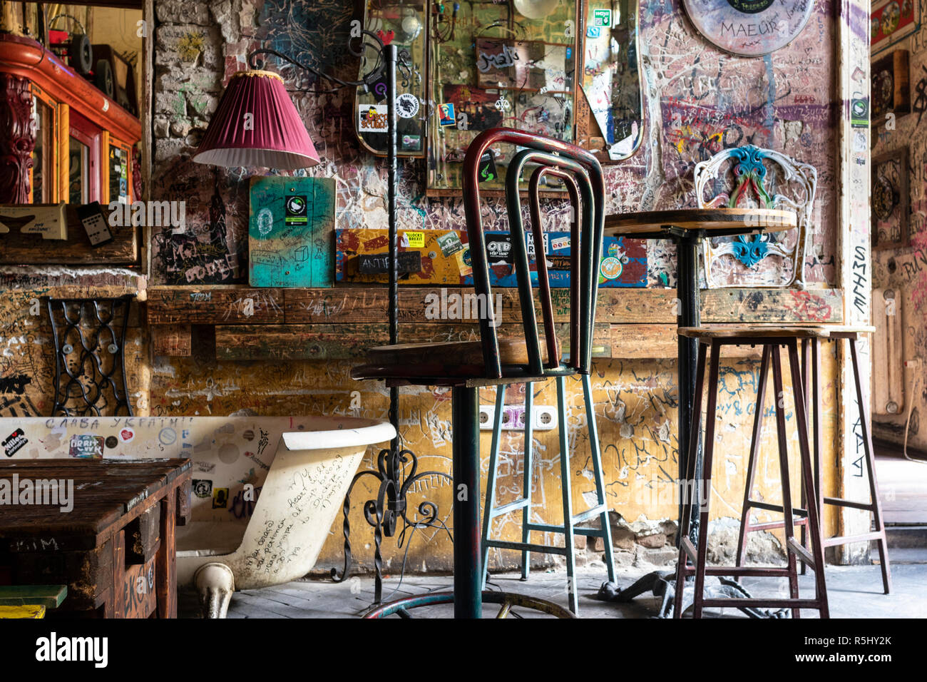 BUDAPEST, HUNGARY - August 12, 2018: Interiors with tattered vintage furniture in Szimpla kert ruin pub and farmers market, a popular tourist destinat Stock Photo