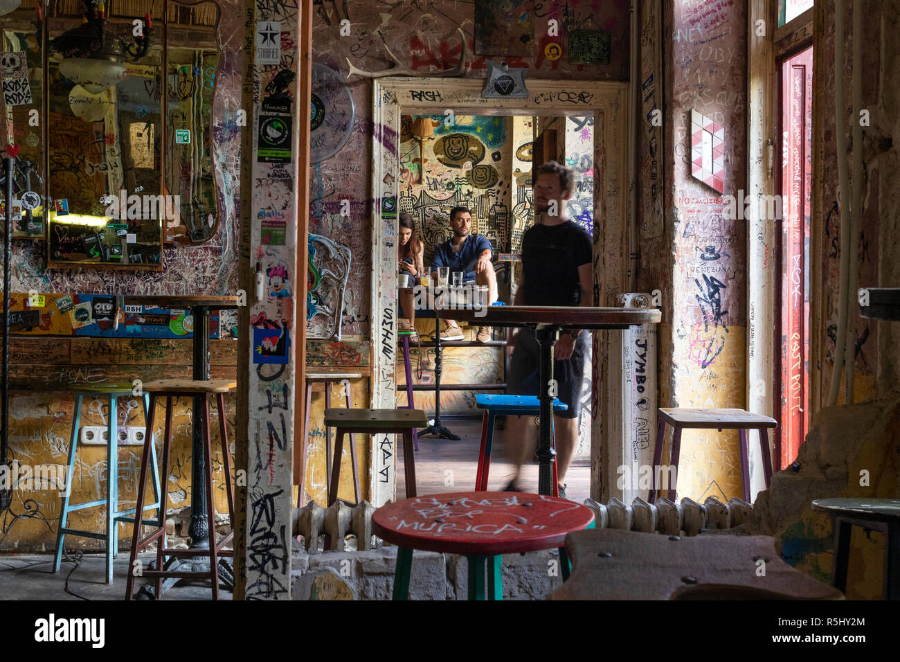 BUDAPEST, HUNGARY - August 12, 2018: Pub interiors with tattered vintage furniture in Szimpla kert ruin pub, a popular tourist destinations in Hungary Stock Photo